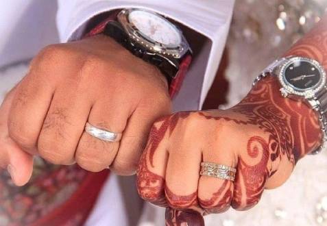 Couple showing Engagement Ring